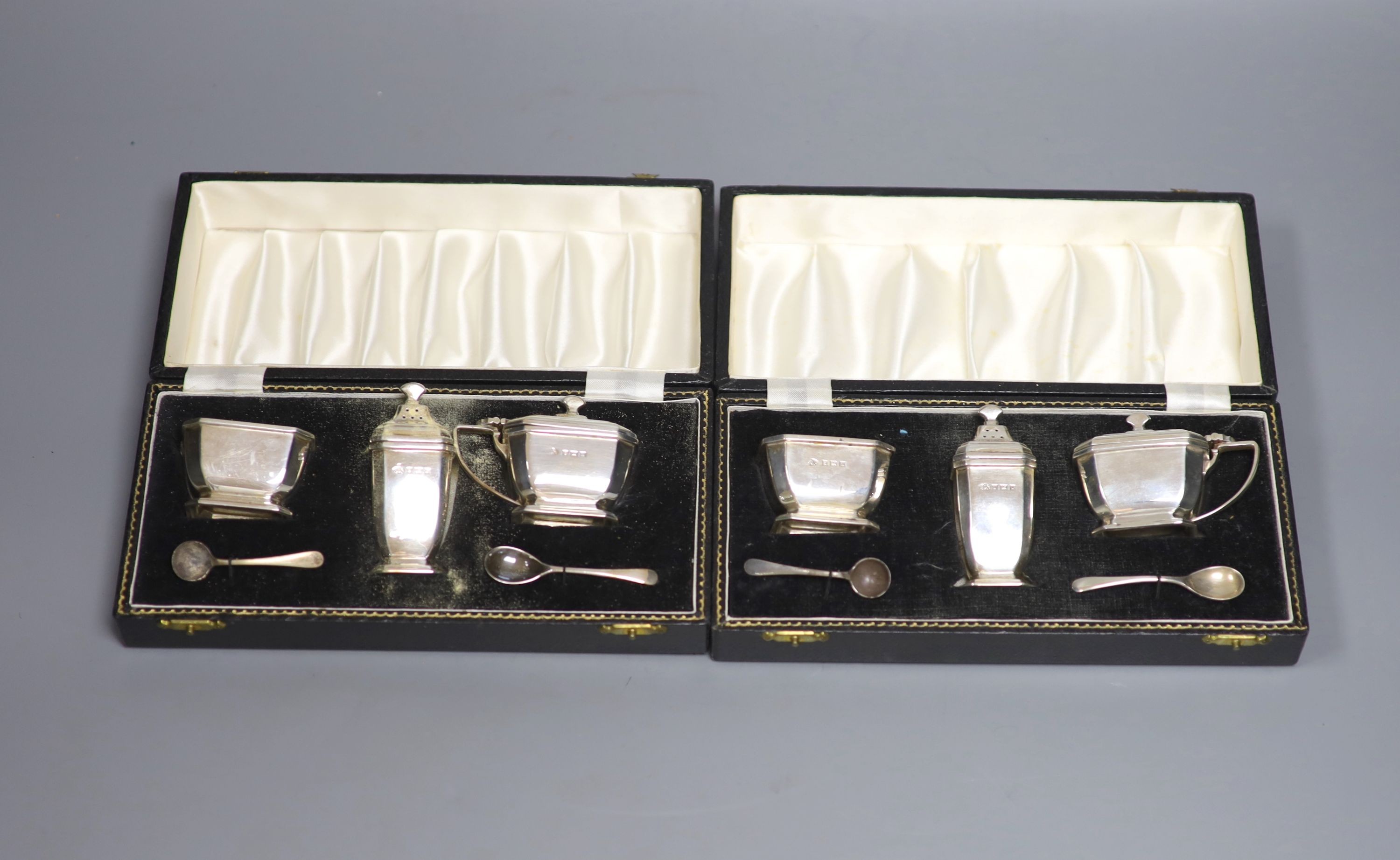Two modern cased three piece silver condiment sets